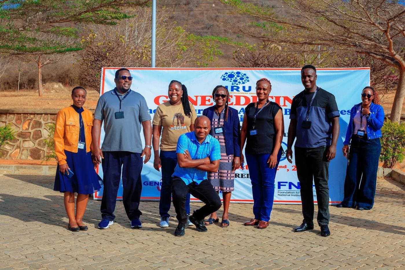 Course team at the event banner